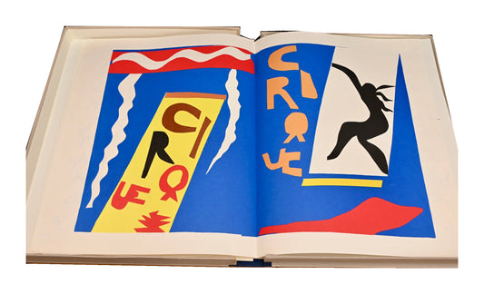 Open spread from the 1983 facsimile of Henri Matisse's Jazz, with bold circus lettering and a black silhouette against blue.