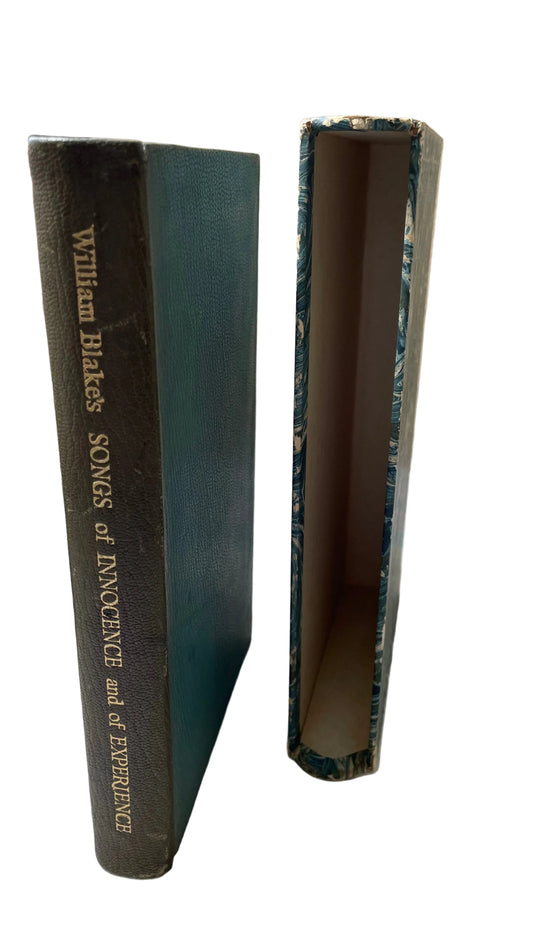 William Blake's Songs of Innocence and of Experience standing beside its empty blue marbled slipcase.