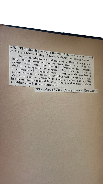 Printed quotation from The Diary of John Quincy Adams pasted onto the brown endpaper of Thoughts of the Emperor Marcus Aurelius Antoninus.