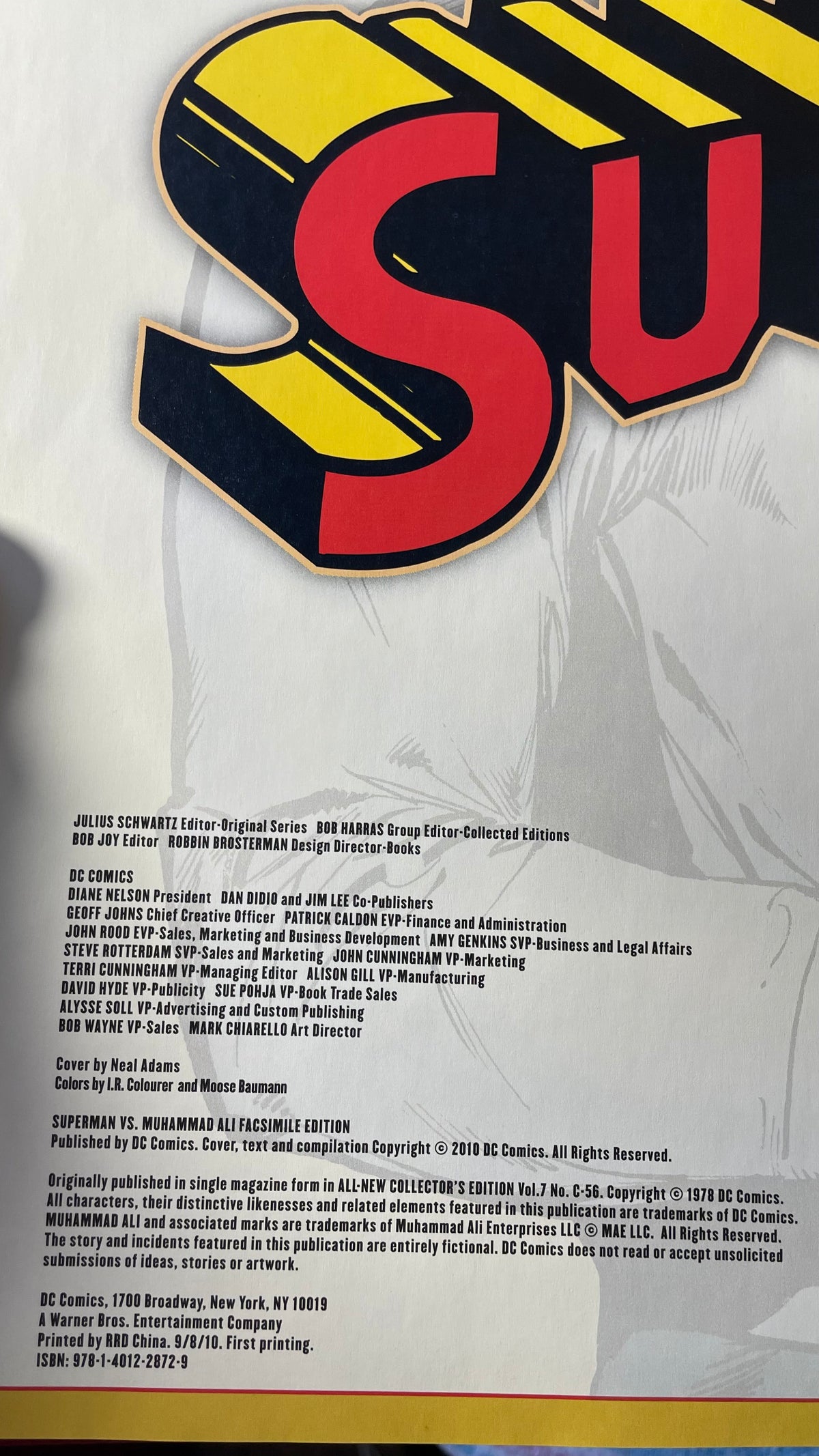Publication and credits page of Superman vs. Muhammad Ali, with cropped Superman title lettering, pale artwork and a yellow border.