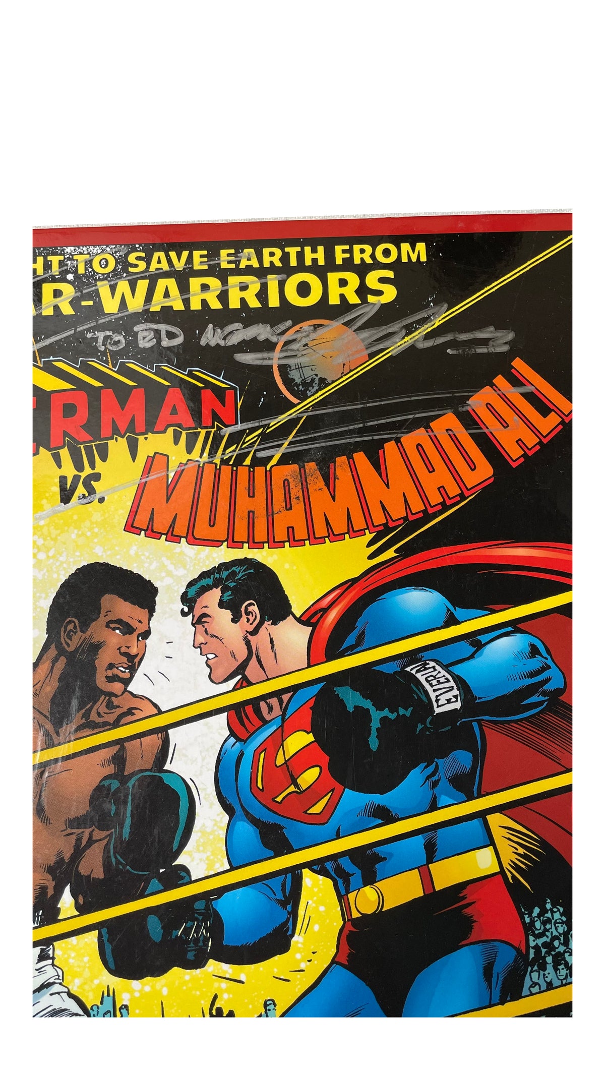 Silver-marker inscription above the boxing scene on Superman vs. Muhammad Ali's cover.