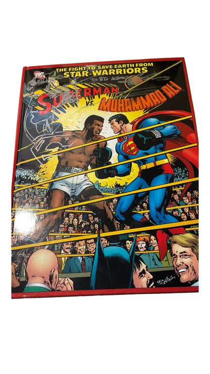 Illustrated Superman vs. Muhammad Ali cover with a silver-marker Superman drawing and inscription.