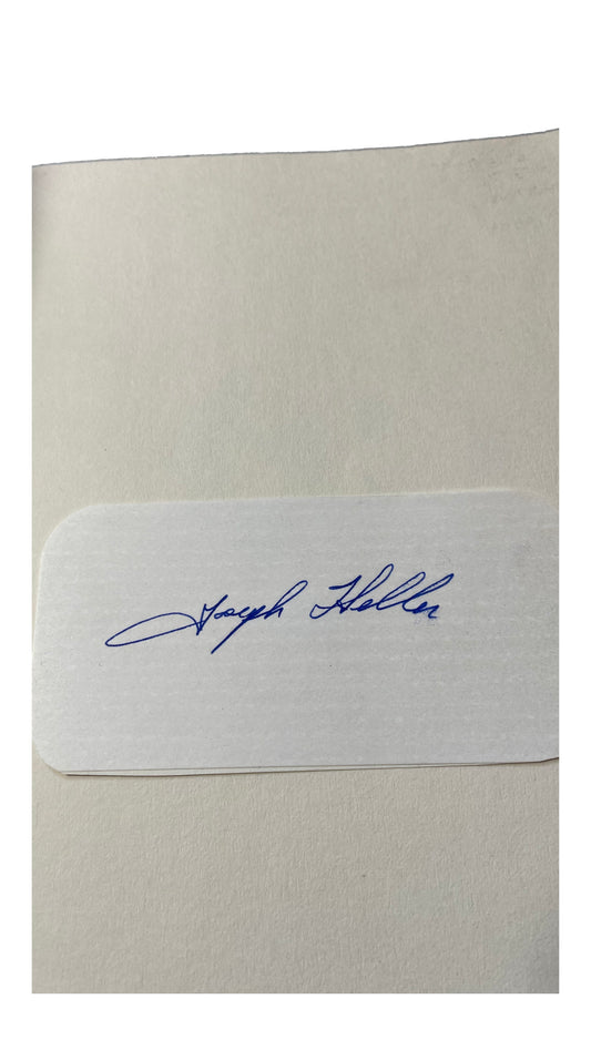 Blue-ink Joseph Heller signature on a white slip inside Catch-22.
