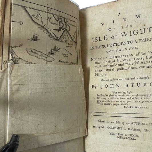 A View of the Isle of Wight open to its title page and partly folded map.