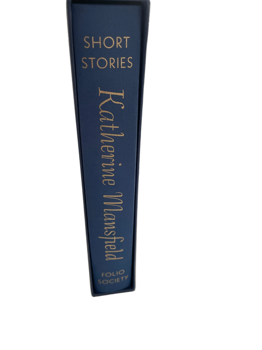 Blue spine of Katherine Mansfield’s Short Stories, with gold lettering inside its blue slipcase.