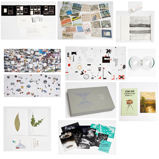 The Valise / La Valija: overview collage of the grey portfolio box, printed artworks, books, a scroll and two glass forms