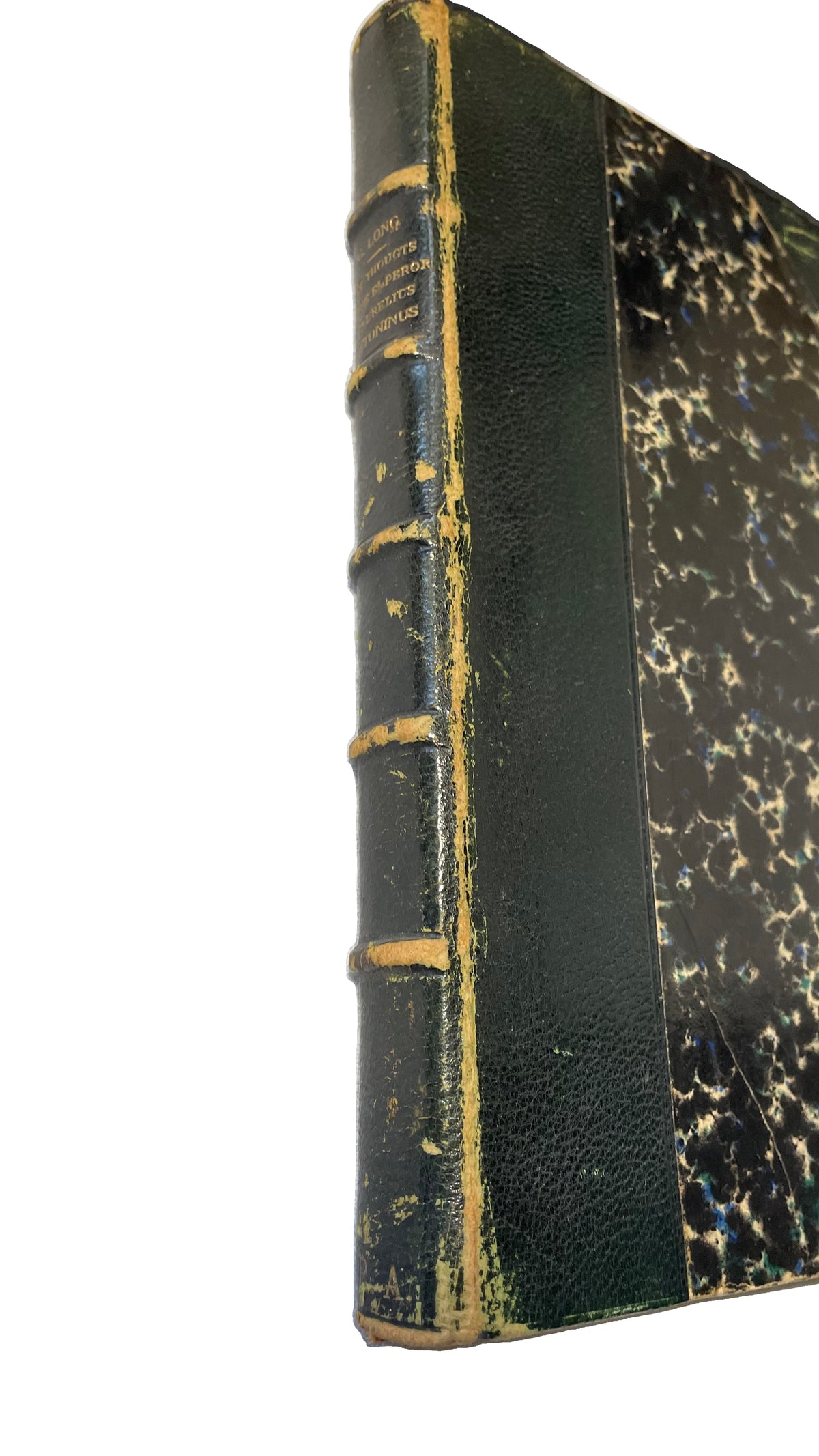 Angled detail of the worn green spine and marbled cover of Thoughts of the Emperor Marcus Aurelius Antoninus.