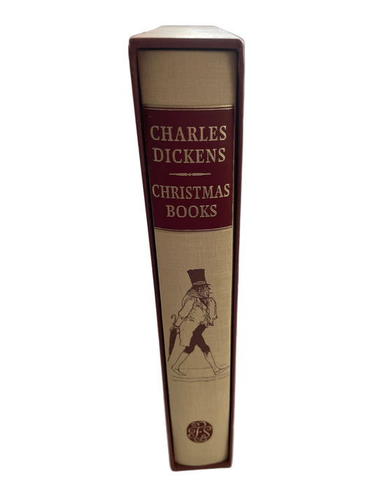 Christmas Books by Charles Dickens, showing its cream and red illustrated spine inside the slipcase.