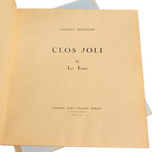 Title page for volume II, Les Fruits, of Jacques Zoubaloff’s Clos Joli, with Paris 1929 imprint, facing leaf and light-blue portfolio visible beneath.