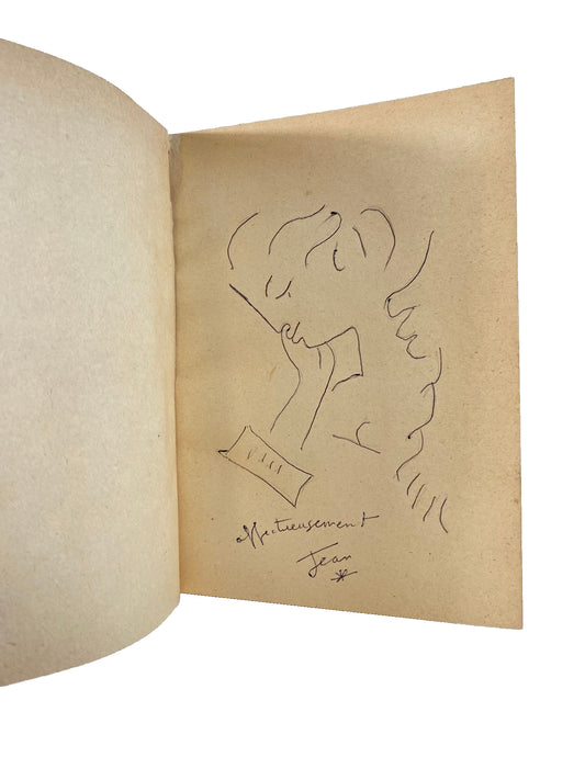 Open leaf in Jean Cocteau’s Le Grand Écart, with an ink profile drawing and handwritten inscription beneath, preserving the toned paper and visible spots.