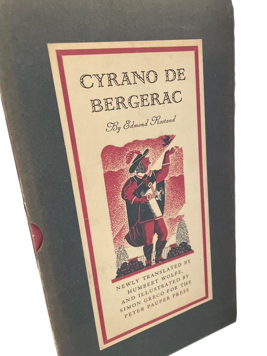 Dark slipcase for Cyrano de Bergerac, with a cream and red illustrated label and visible wear along the edges.