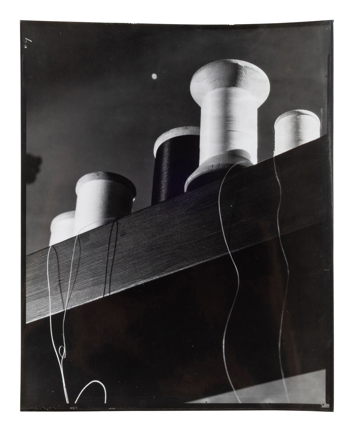 Anton Bruehl — Five photographs — Spools, Peter Lorre, and other works — historical auction photograph 2